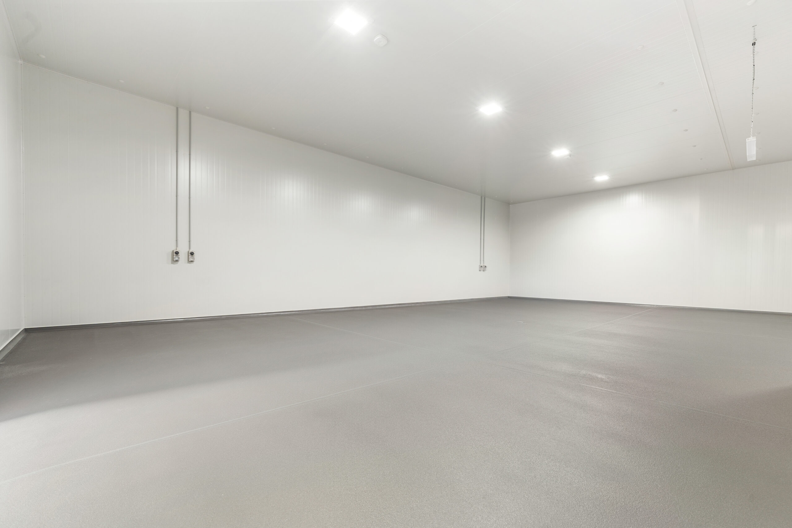 Light grey flake epoxy floor in a commercial fitout
